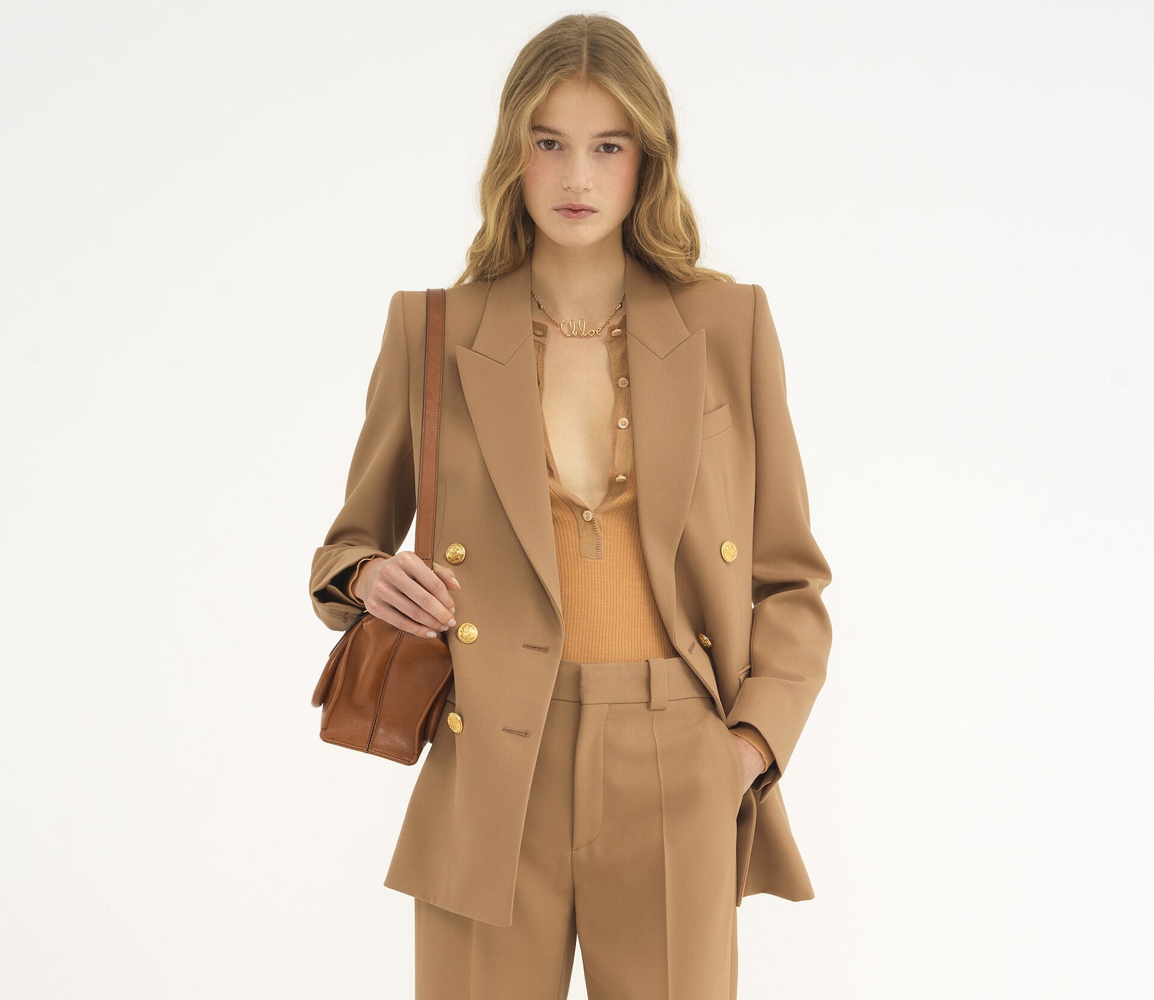 Saphira Krumhaar is wearing the Coconut Brown Tailored jacket and pant in wool grain de poudre