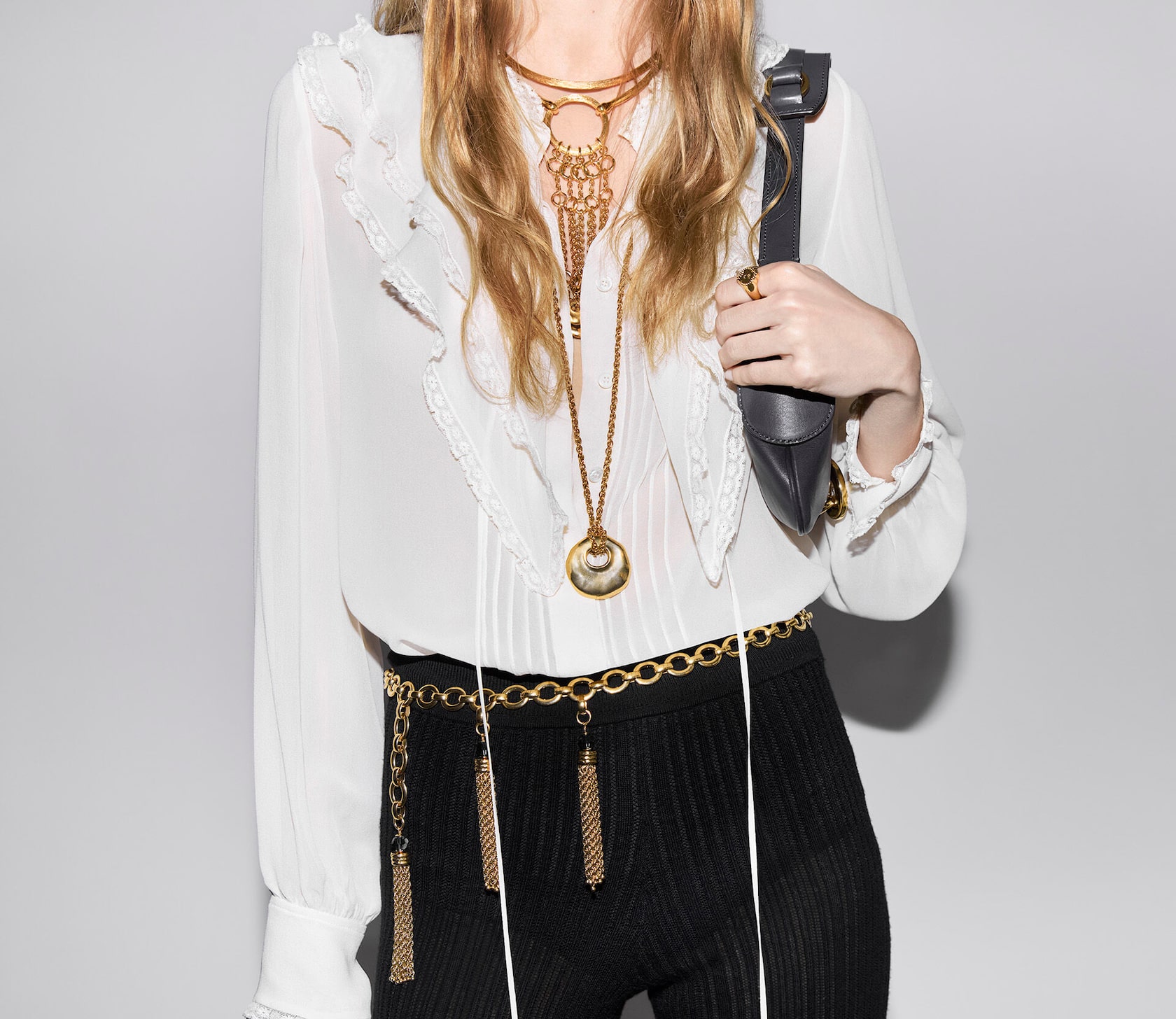 Close-up of the Iconic Milk gathered top in lace and the Chloé Iconic small belt vintage gold