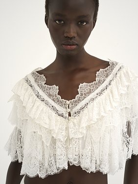 Heritage V-neck lace top Floral lace mix
Pristine White Front view of the product being worn