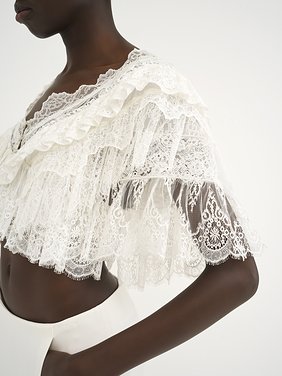 Heritage V-neck lace top Floral lace mix
Pristine White Front view of the product being worn