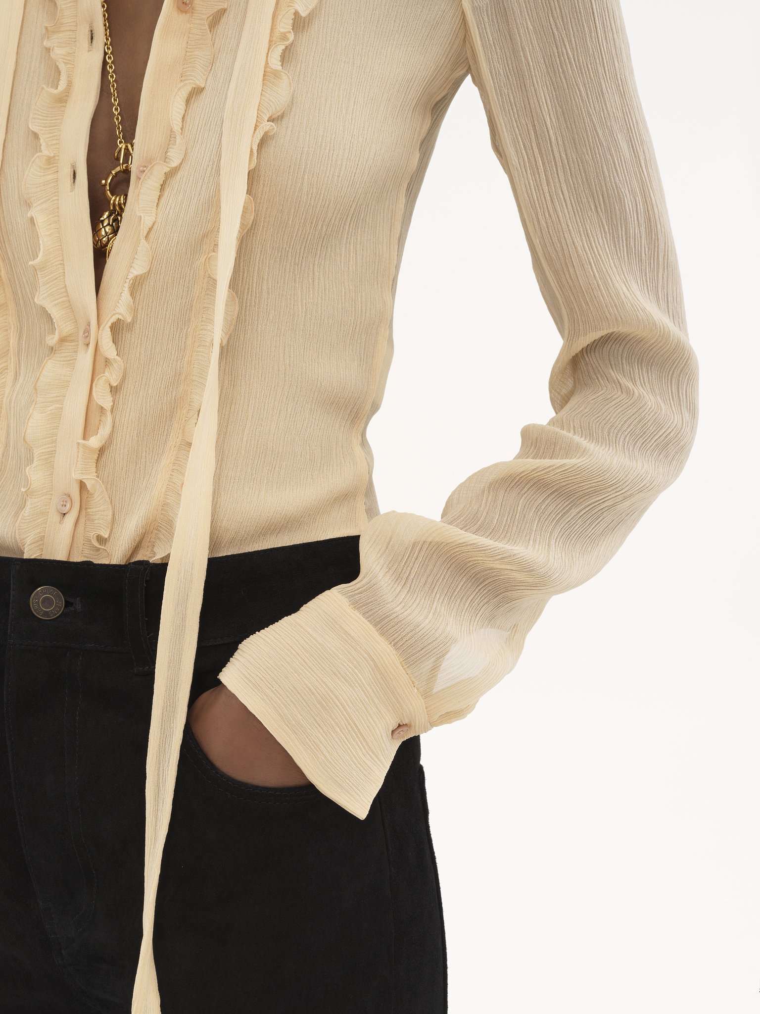 Ruffled fitted blouse in silk crêpon Iconic organic silk crêpon
Light Sand Front view of the product being worn