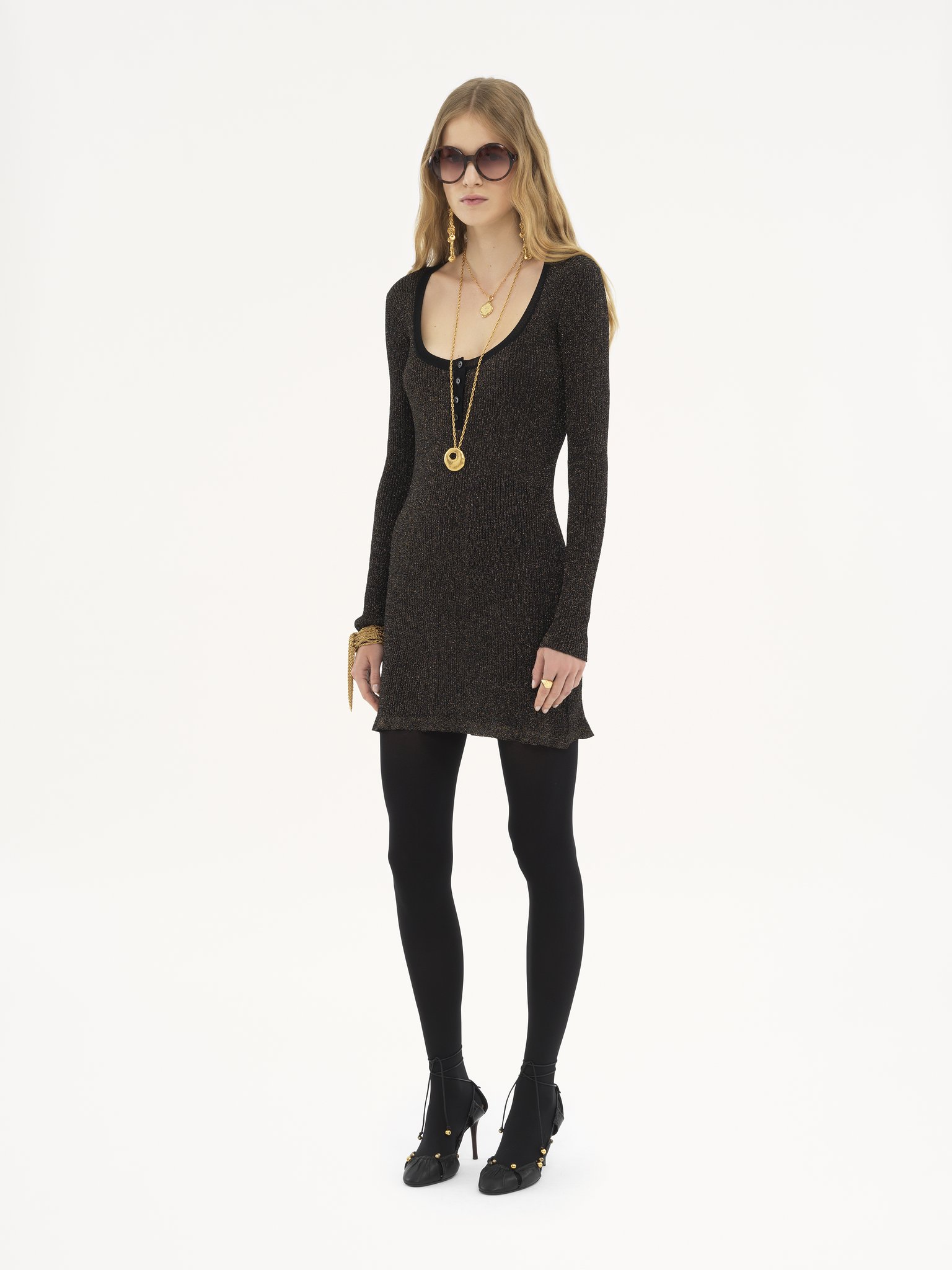 Fitted mini dress in lurex knit Lurex ribbed knit
Black Gold Back view of the product