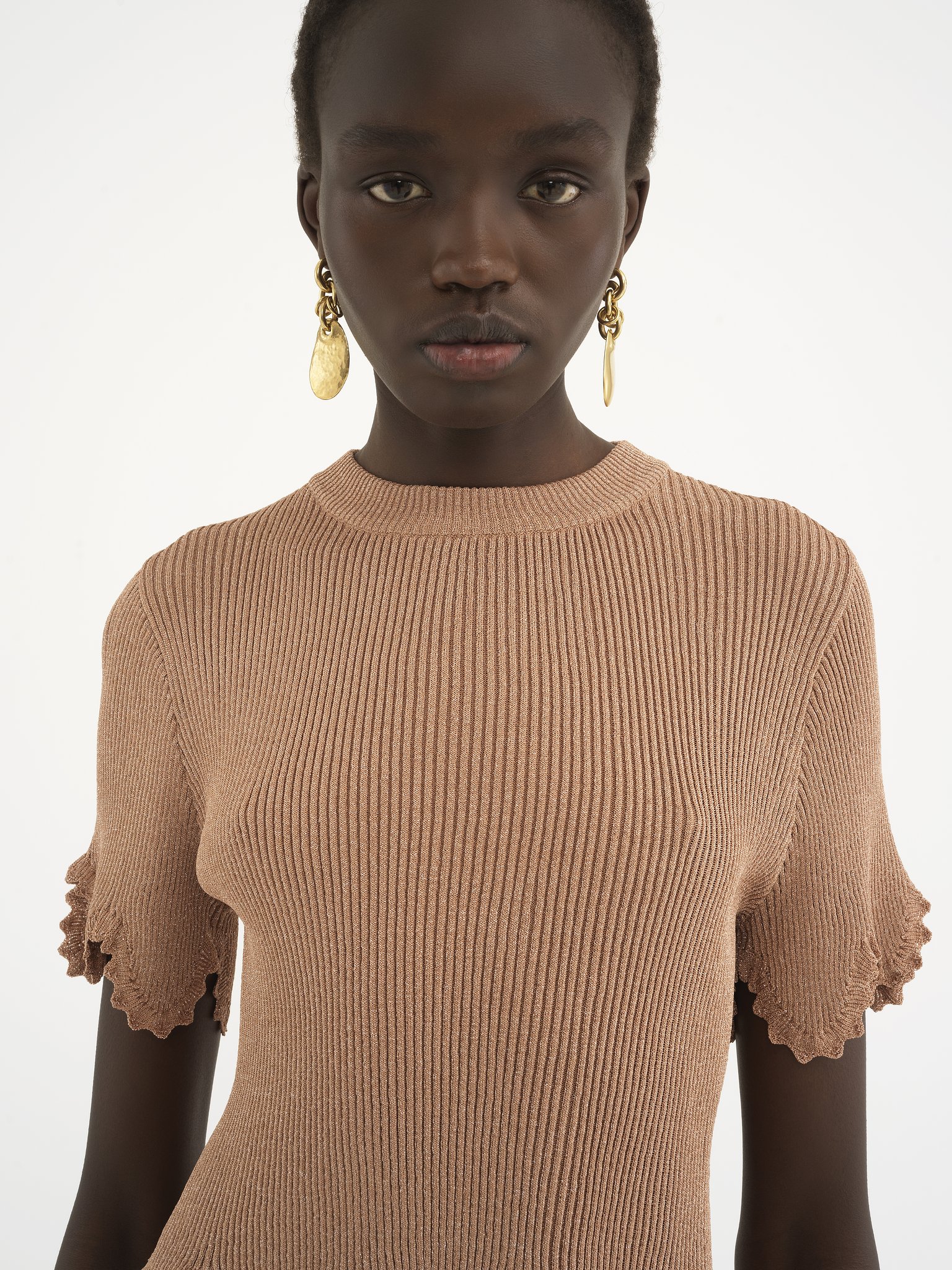 Cropped scallop top in viscose-blend knit Viscose & metallic lurex rib knit
Lovely Beige Front view of the product being worn