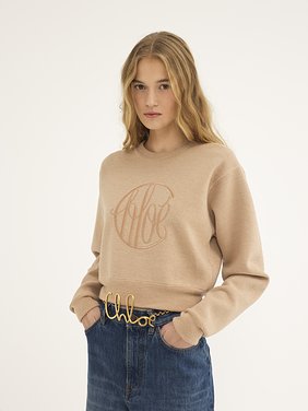 Knitted logo sweater in wool Lower-impact signature knit
Straw Beige Product detail