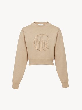 Knitted logo sweater in wool Lower-impact signature knit
Straw Beige