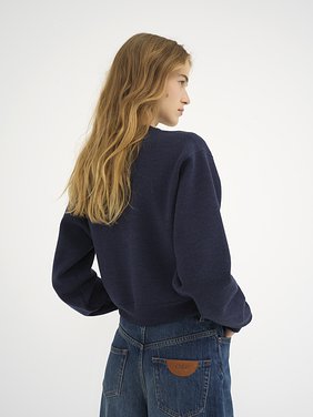 Knitted logo sweater in wool Lower-impact signature knit
Classic Navy Top view of the product