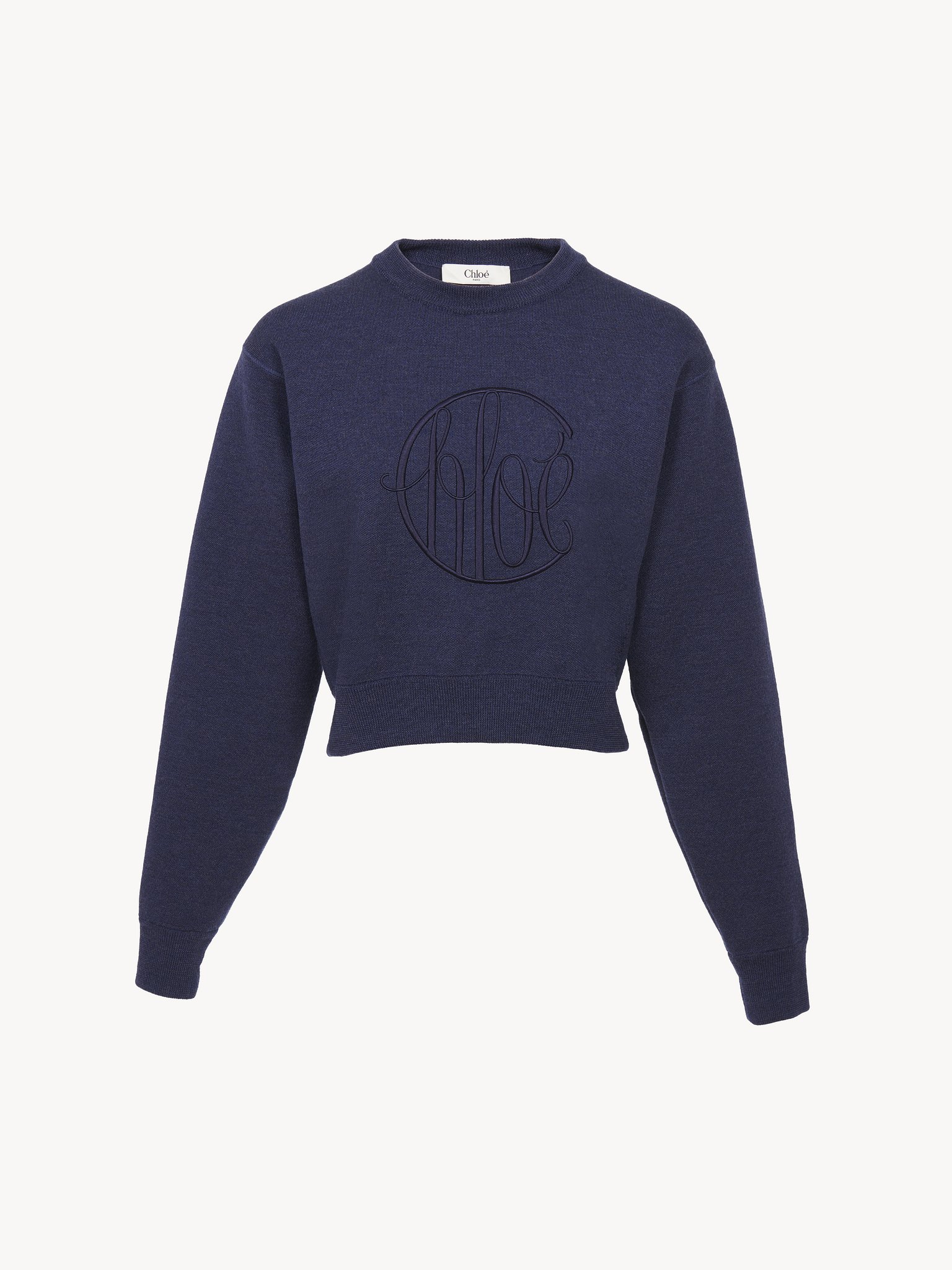 Knitted logo sweater in wool Lower-impact signature knit
Classic Navy