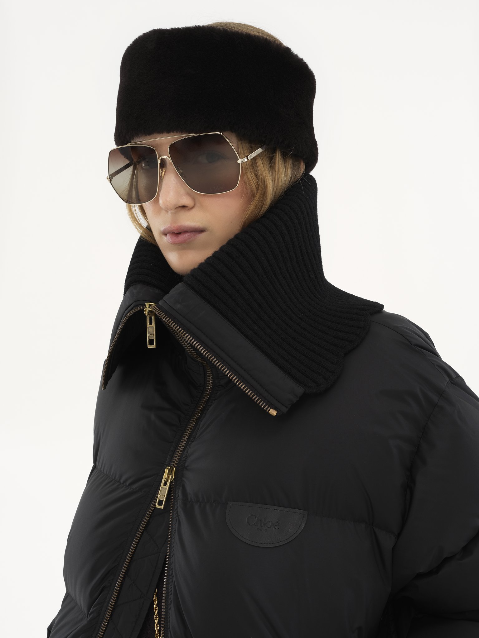 High-neck puffer jacket in shiny nylon Shiny recycled nylon
Black Front view of the product being worn