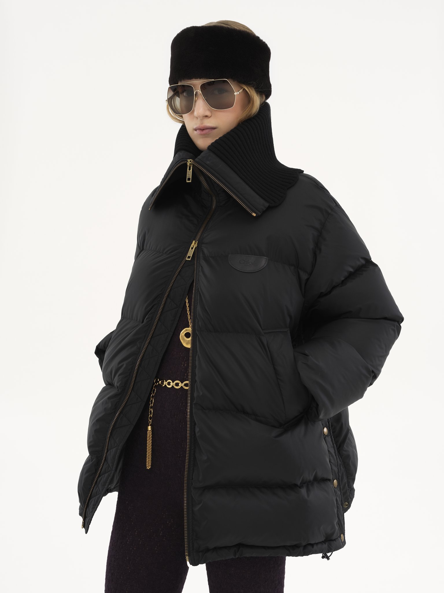 High-neck puffer jacket in shiny nylon Shiny recycled nylon
Black Product detail