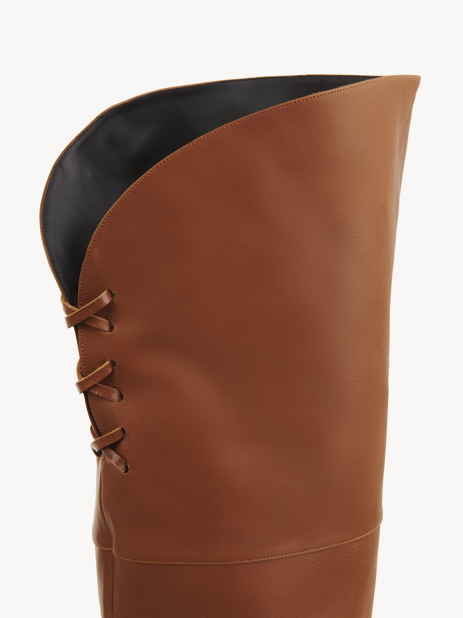 Eve over-the-knee boot Shiny calfskin
Clay Brown Front view of the product being worn