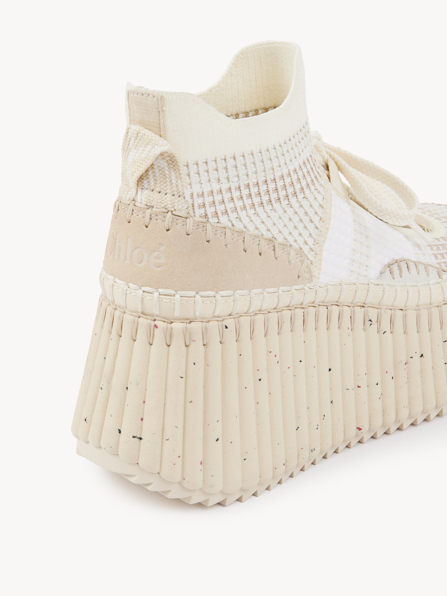 Nama wedge sneaker Lower impact mesh
Seedpearl Beige Front view of the product being worn