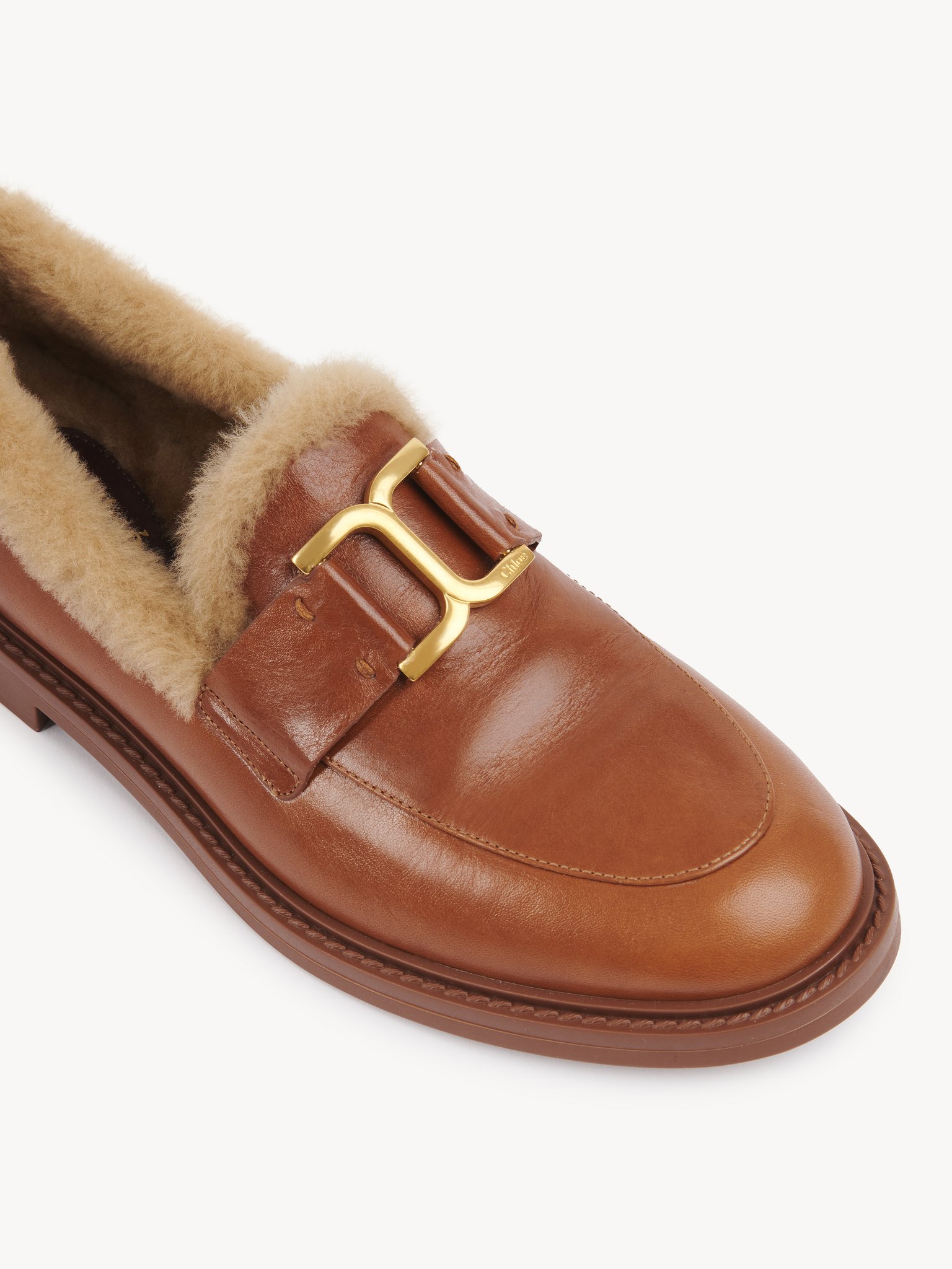 Marcie loafer Calfskin with shearling
Cognac Brown Front view of the product being worn