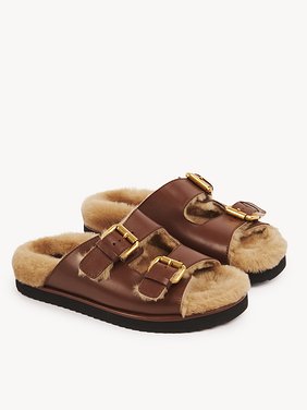 Nil slide Calfskin with shearling
Sooty Brown Product detail