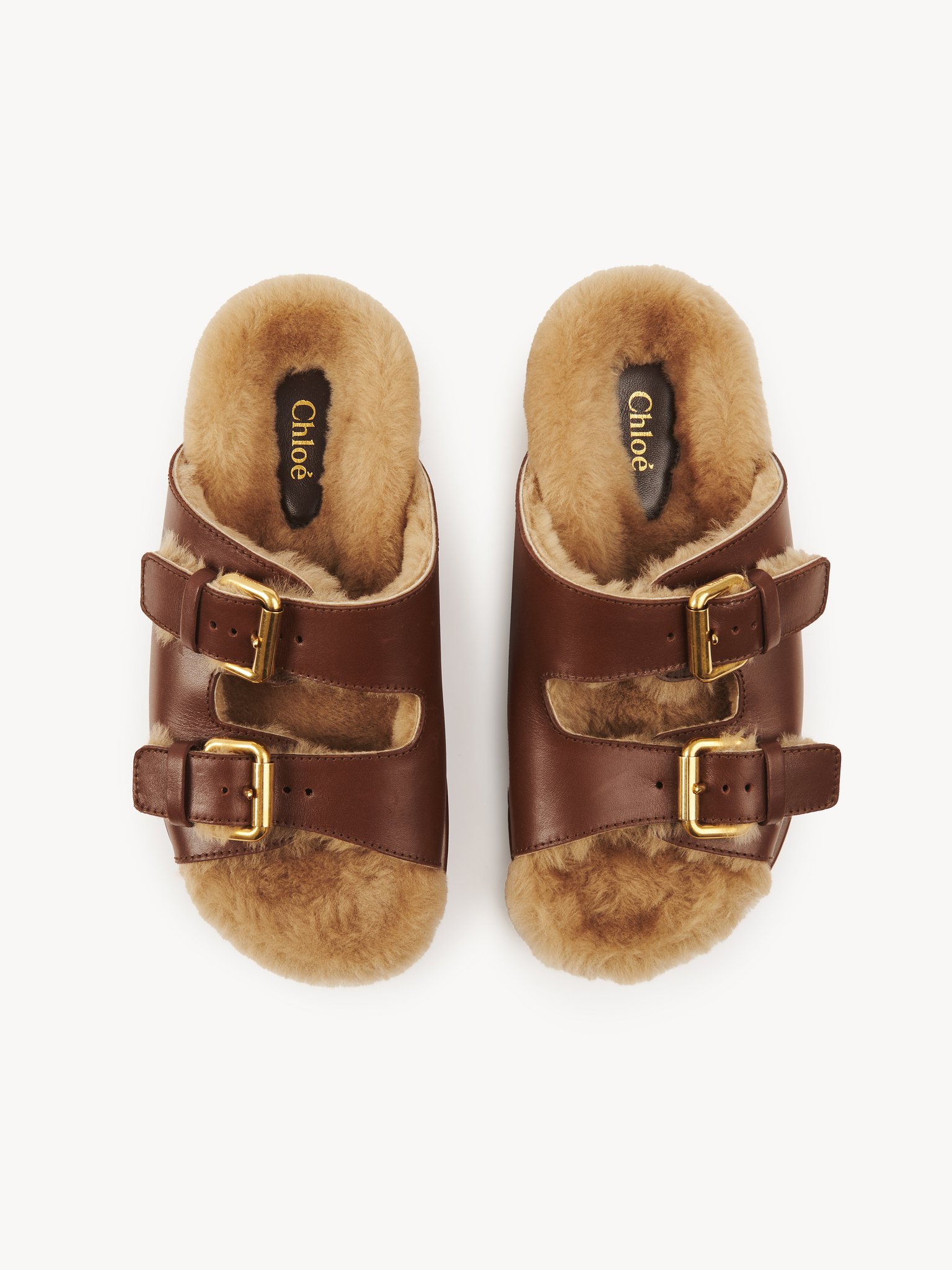 Nil slide Calfskin with shearling
Sooty Brown Top view of the product