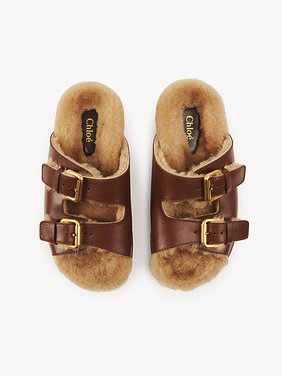 Nil slide Calfskin with shearling
Sooty Brown Top view of the product