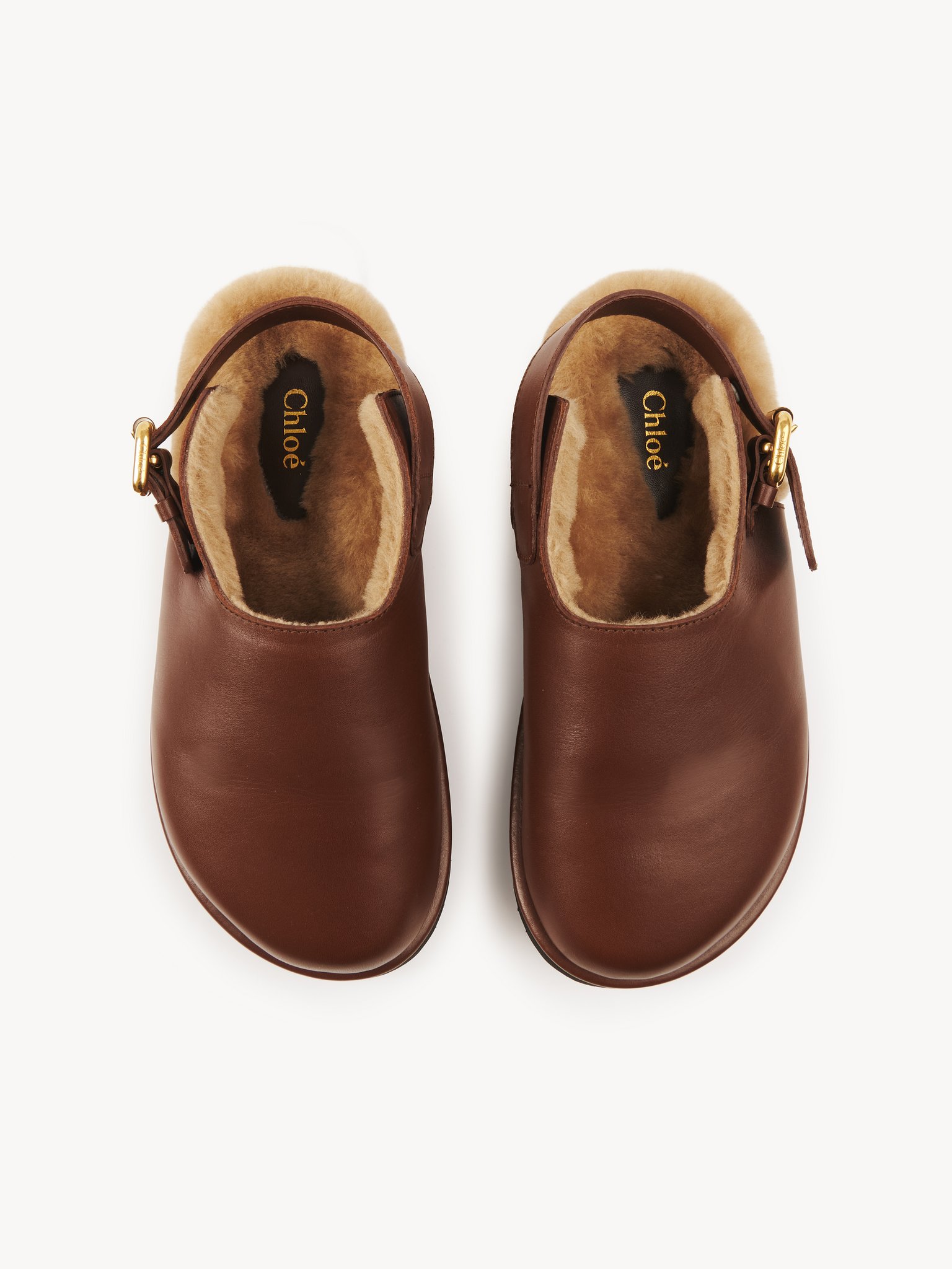 Nil mule Calfskin with shearling
Sooty Brown 