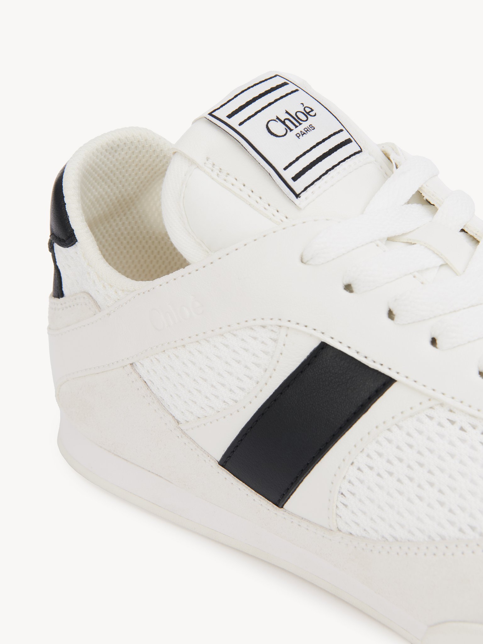 Chloé Kick sneaker Mesh & calfskin
White - Black Front view of the product being worn