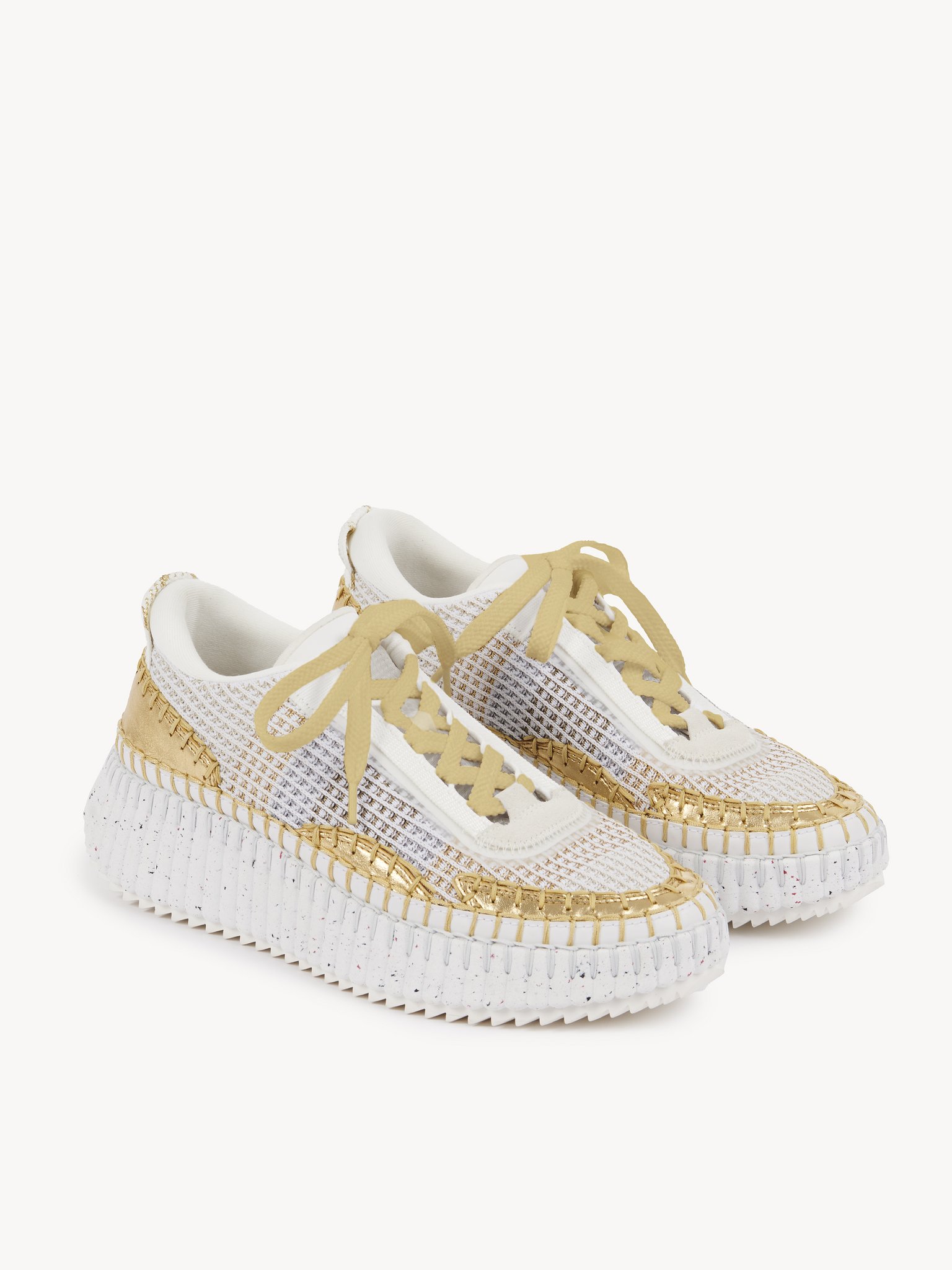 Nama sneaker Lower-impact mesh & crackled calfskin
Gold Product detail