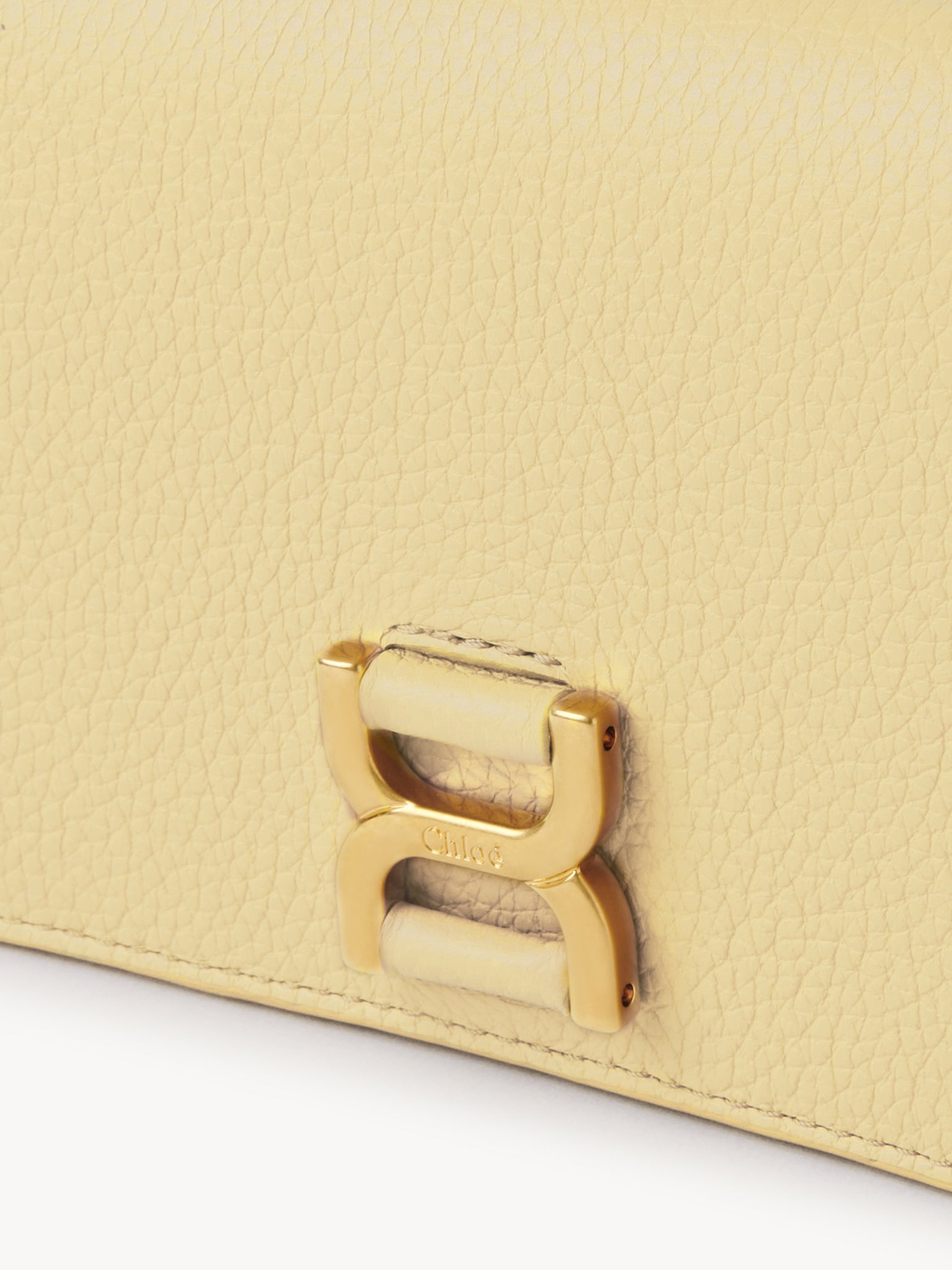 Marcie long wallet with flap Grained calfskin
Softy Yellow Front view of the product being worn