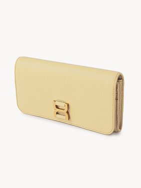 Marcie long wallet with flap Grained calfskin
Softy Yellow Back view of the product