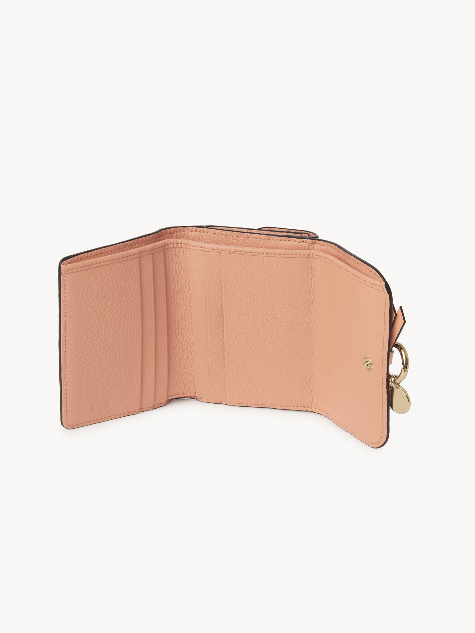 Small Alphabet tri-fold in grained leather Grained & shiny calfskin
Terracotta Pink Front view of the product being worn