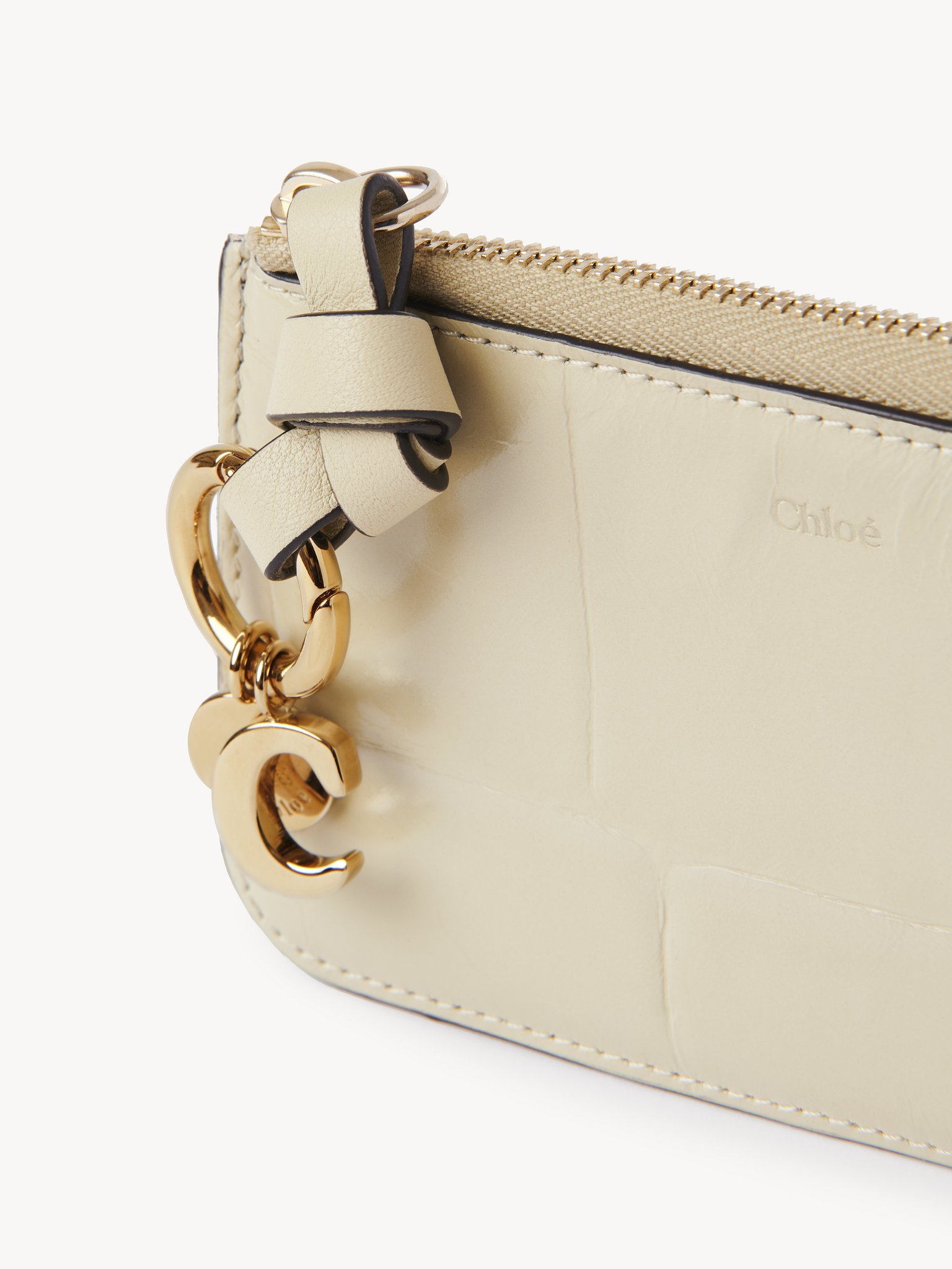 Alphabet wallet in croco-effect leather Croco-effect calfskin
Vegetal Beige Front view of the product being worn