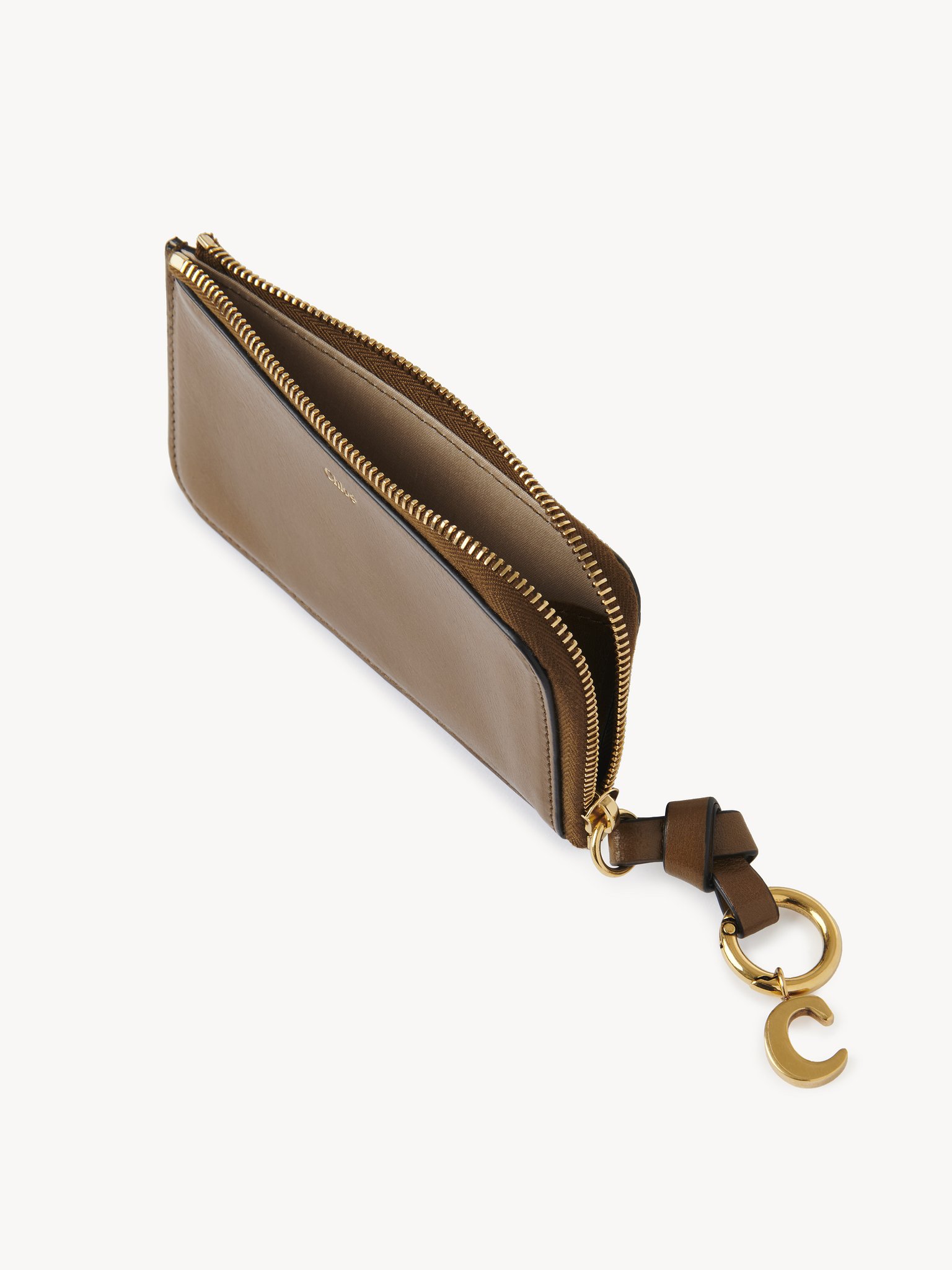 Alphabet purse in shiny leather Natural shiny buffalo leather
Dark Khaki Product detail