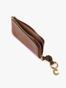 Alphabet purse in shiny leather Natural shiny buffalo leather
Clay Brown Product detail