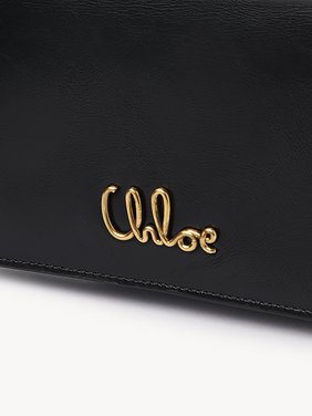 Chloé Iconic flap wallet on chain in shiny leather Shiny calfskin
Black Front view of the product being worn