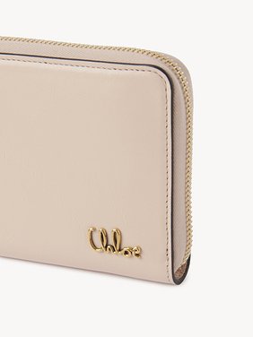 Chloé Iconic zipped long wallet in shiny leather Shiny calfskin
Cement Pink Front view of the product being worn