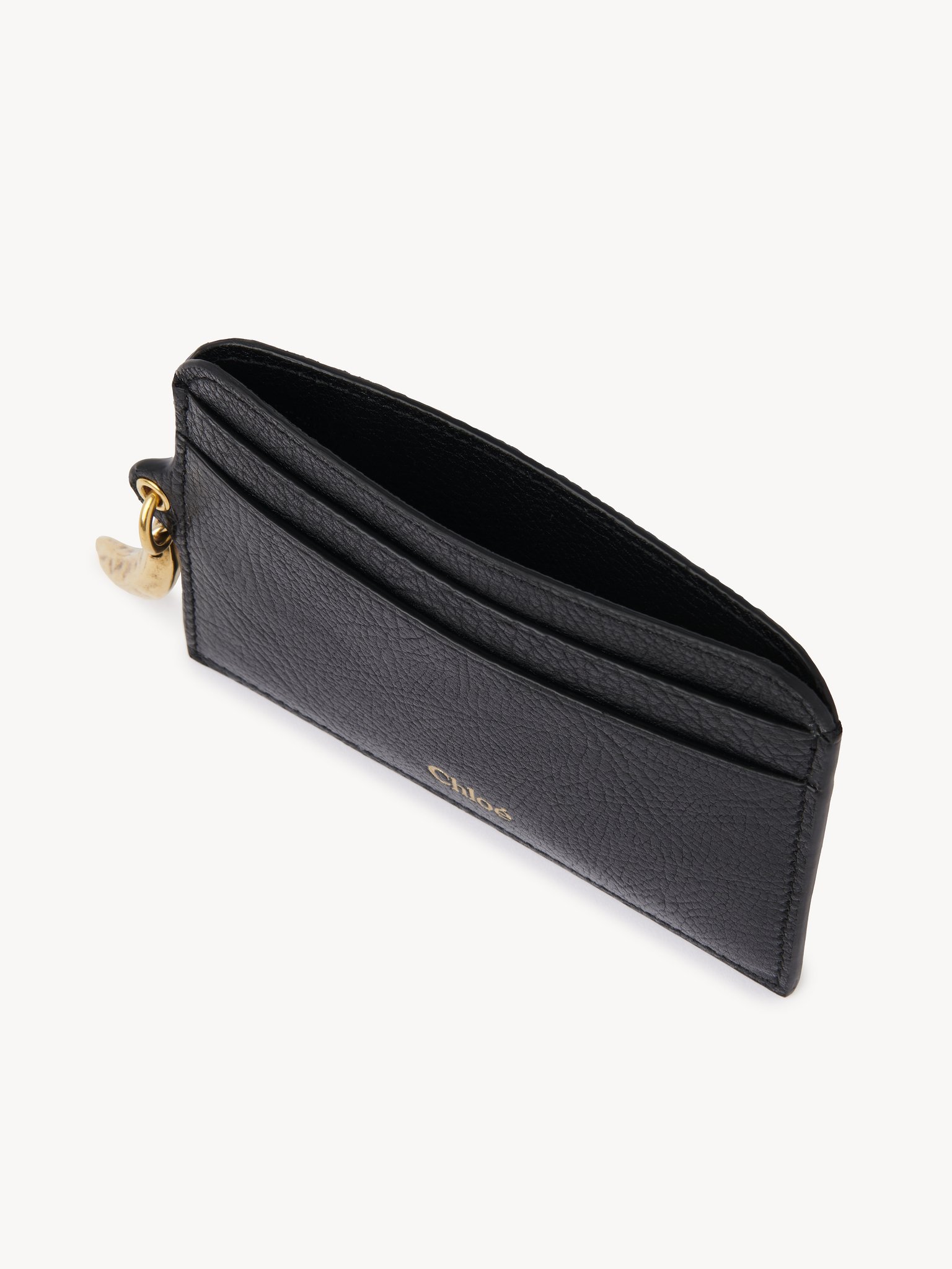 Banana card holder in grained leather Shiny grained calfskin
Black Product detail