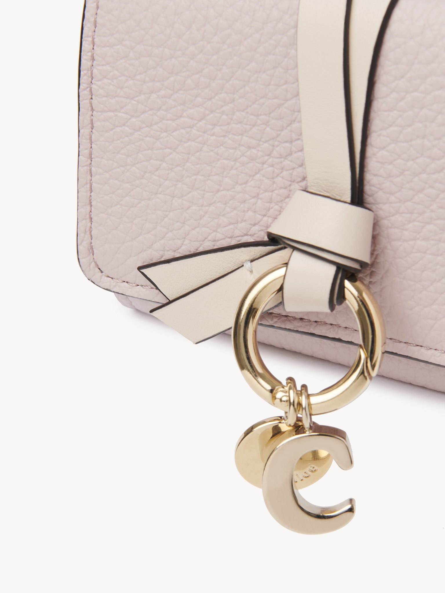 Mini Alphabet tri-fold in grained leather Grained & shiny calfskin
Pink - Beige Front view of the product being worn