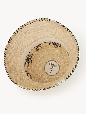 Bell hat in raffia Natural raffia
Beige - Black Front view of the product being worn