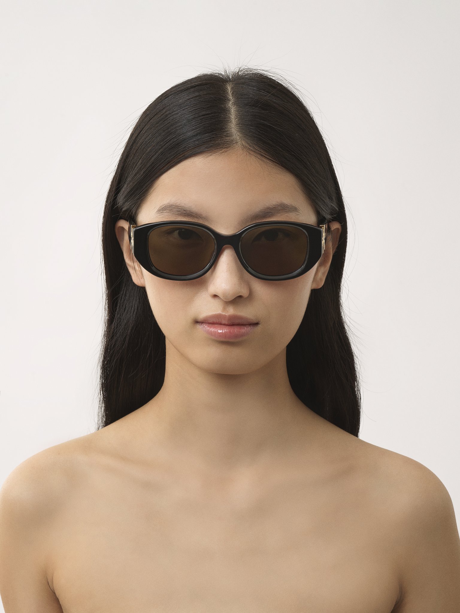 Marcie sunglasses Black lower-impact acetate & bio-based nylon 
Brown lenses Front view of the product being worn