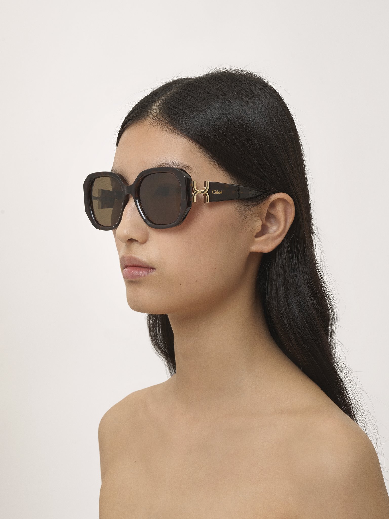 Marcie sunglasses Dark Havana lower-impact acetate & bio-based nylon 
Brown lenses Front view of the product being worn