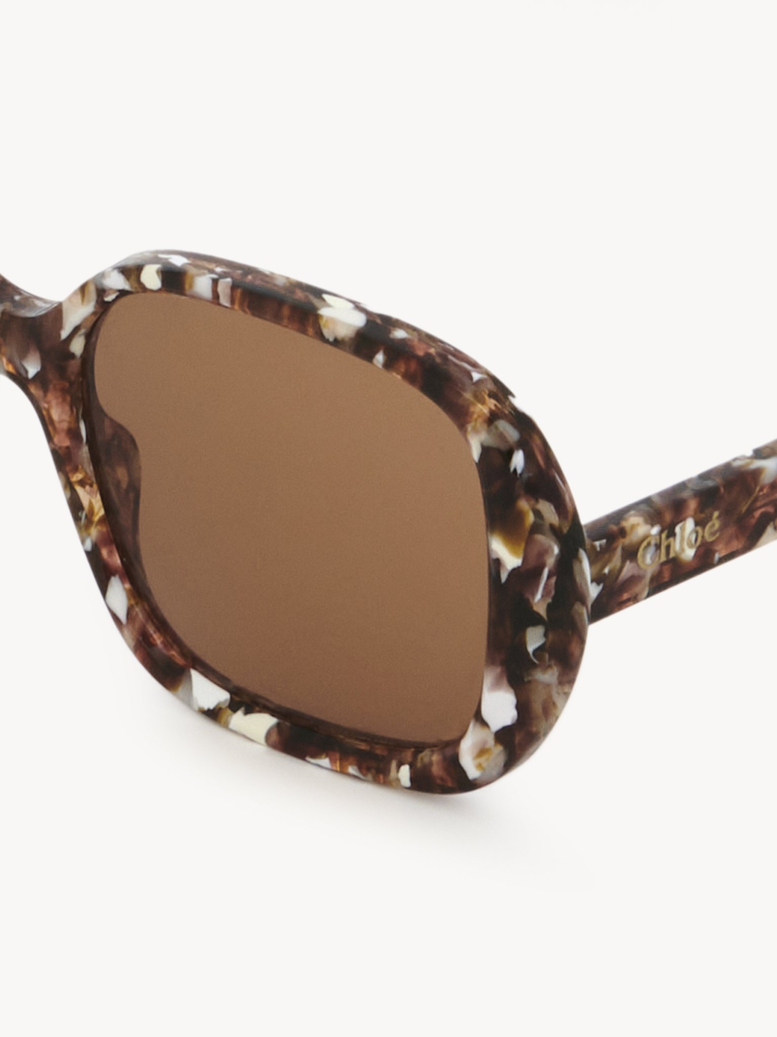 Gayia sunglasses Mottled Beige recycled acetate & bio-based nylon
Solid Brown lenses Top view of the product