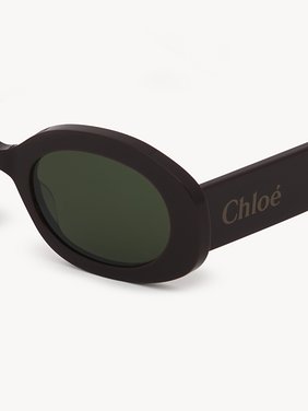 Naomy sunglasses Lower-impact acetate & bio-based nylon
Shiny solid dark Burgundy, solid dark green lenses 