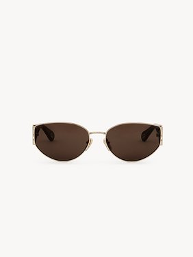 Marcie sunglasses Lower-impact acetate, metal & bio-based nylon
Shiny classic gold & shiny medium Havana, solid light brown lenses Back view of the product