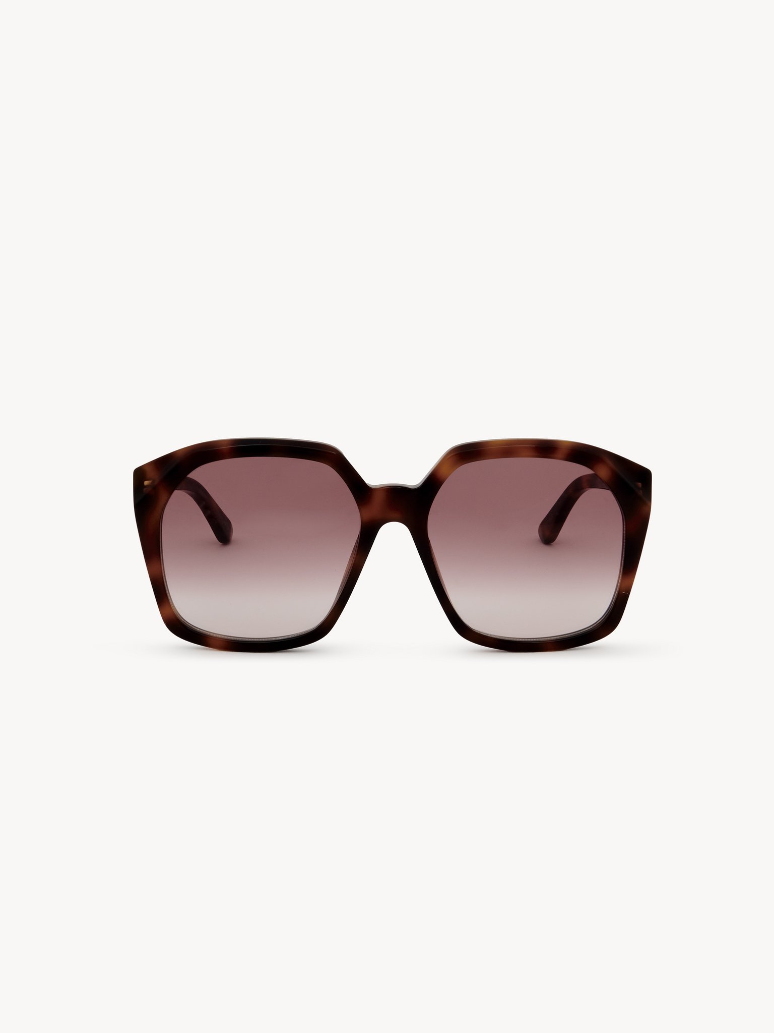 Salome sunglasses Lower-impact acetate & bio-based nylon
Shiny medium Havana, gradient Burgundy/crystal lenses Back view of the product