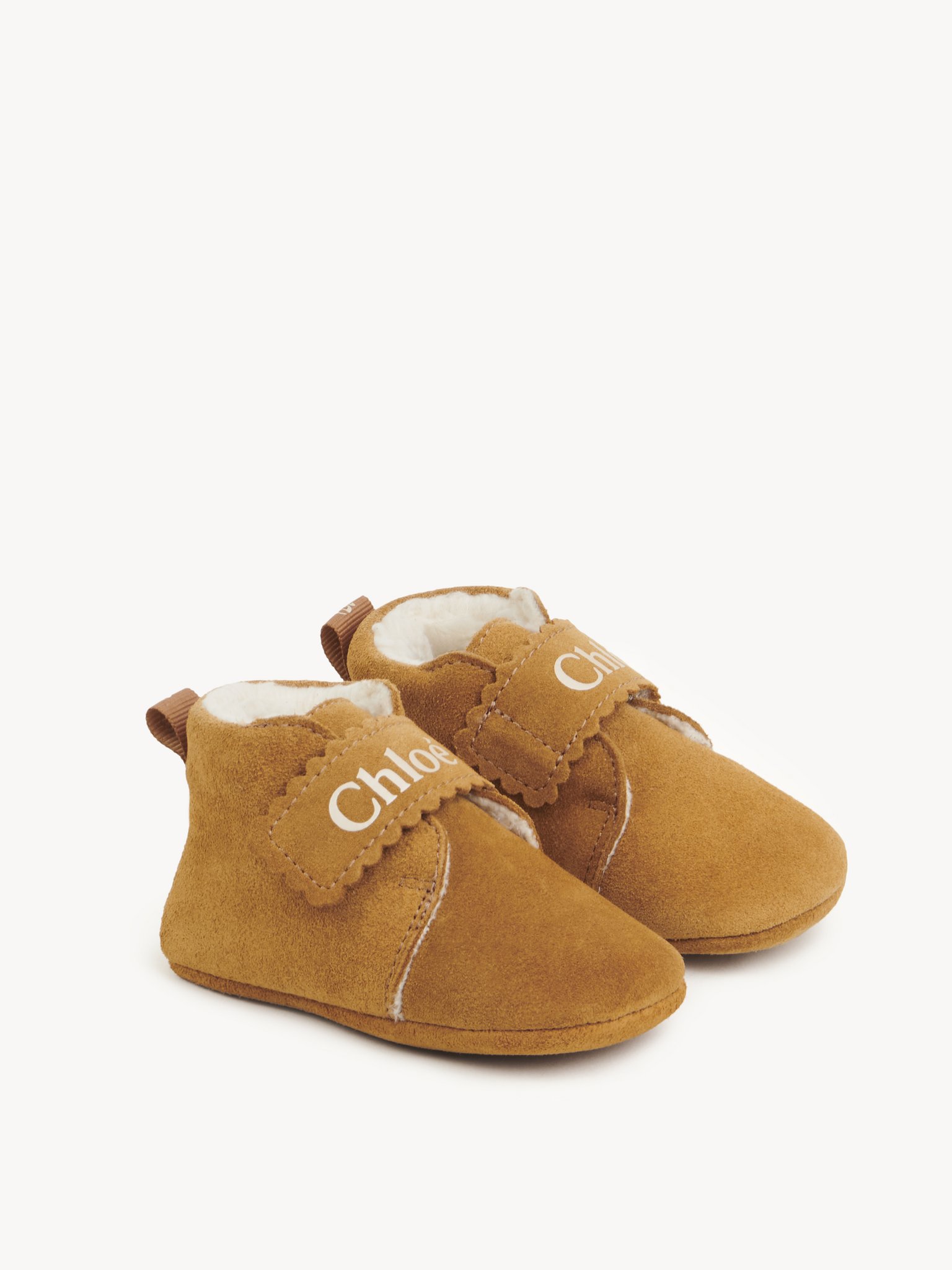 Baby’s slippers Suede cowhide
Stone Top view of the product