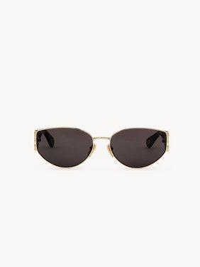 Marcie sunglasses Lower-impact acetate, metal & bio-based nylon
Shiny classic gold & shiny solid black, solid gray lenses Back view of the product