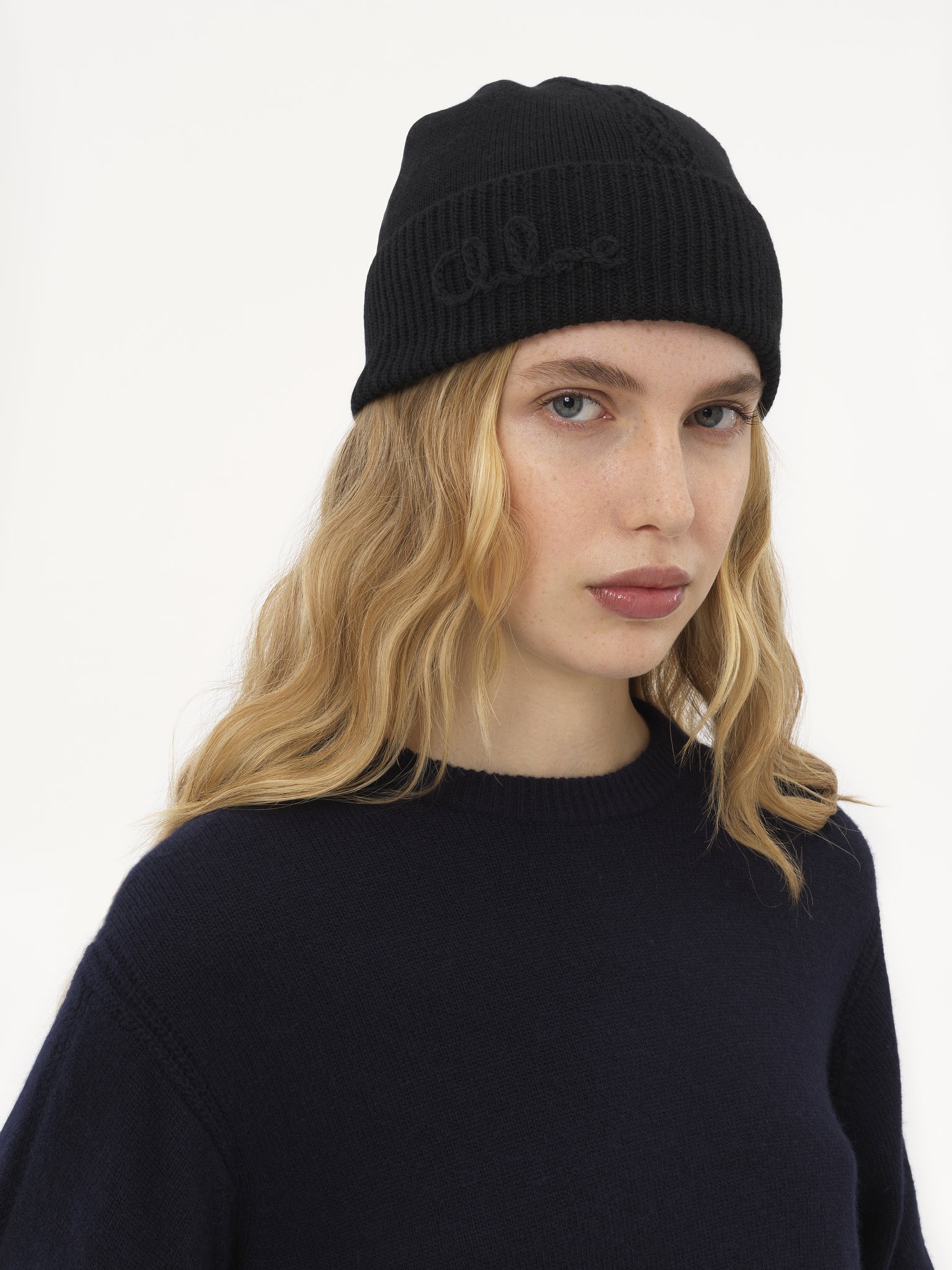 The Chloé Lace Knit beanie in wool & lace jacquard Merino wool & lace jacquard
Black Front view of the product being worn