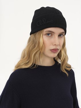 The Chloé Lace Knit beanie in wool & lace jacquard Merino wool & lace jacquard
Black Front view of the product being worn