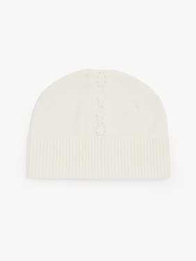 The Chloé Lace Knit beanie in wool & lace jacquard Merino wool & lace jacquard
Off White Front view of the product being worn