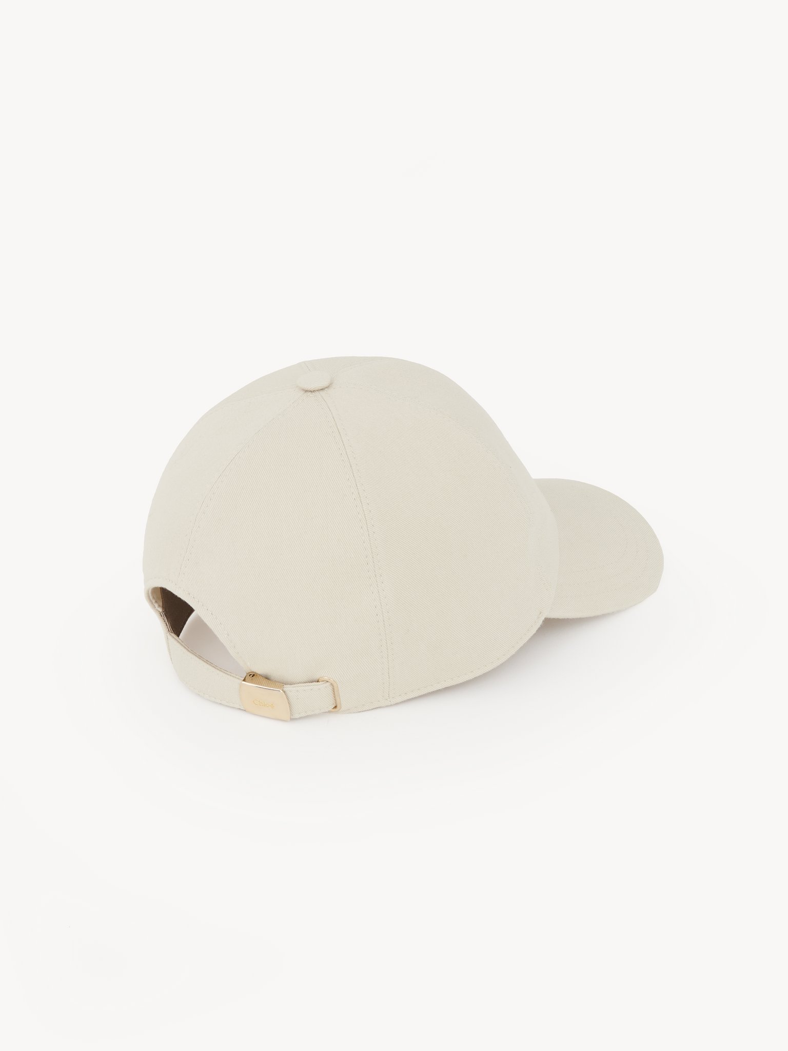 The Chloé Iconic cap in cotton canvas Deadstock recycled cotton gabardine & brass Chloé logo
Cement Beige Product detail