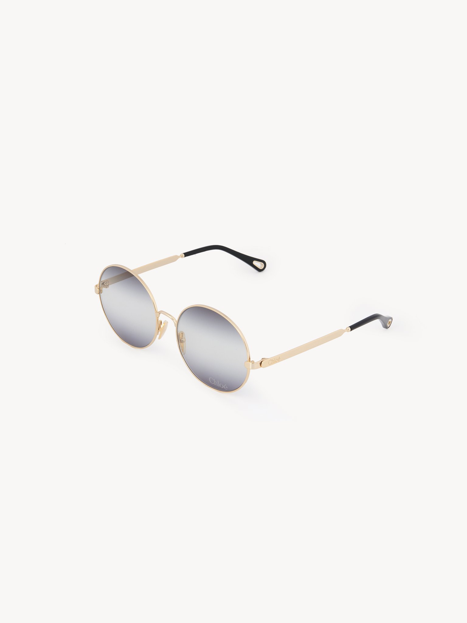 Aly sunglasses Gold metal & bio-based nylon
Gradient black, light grey & grey lenses