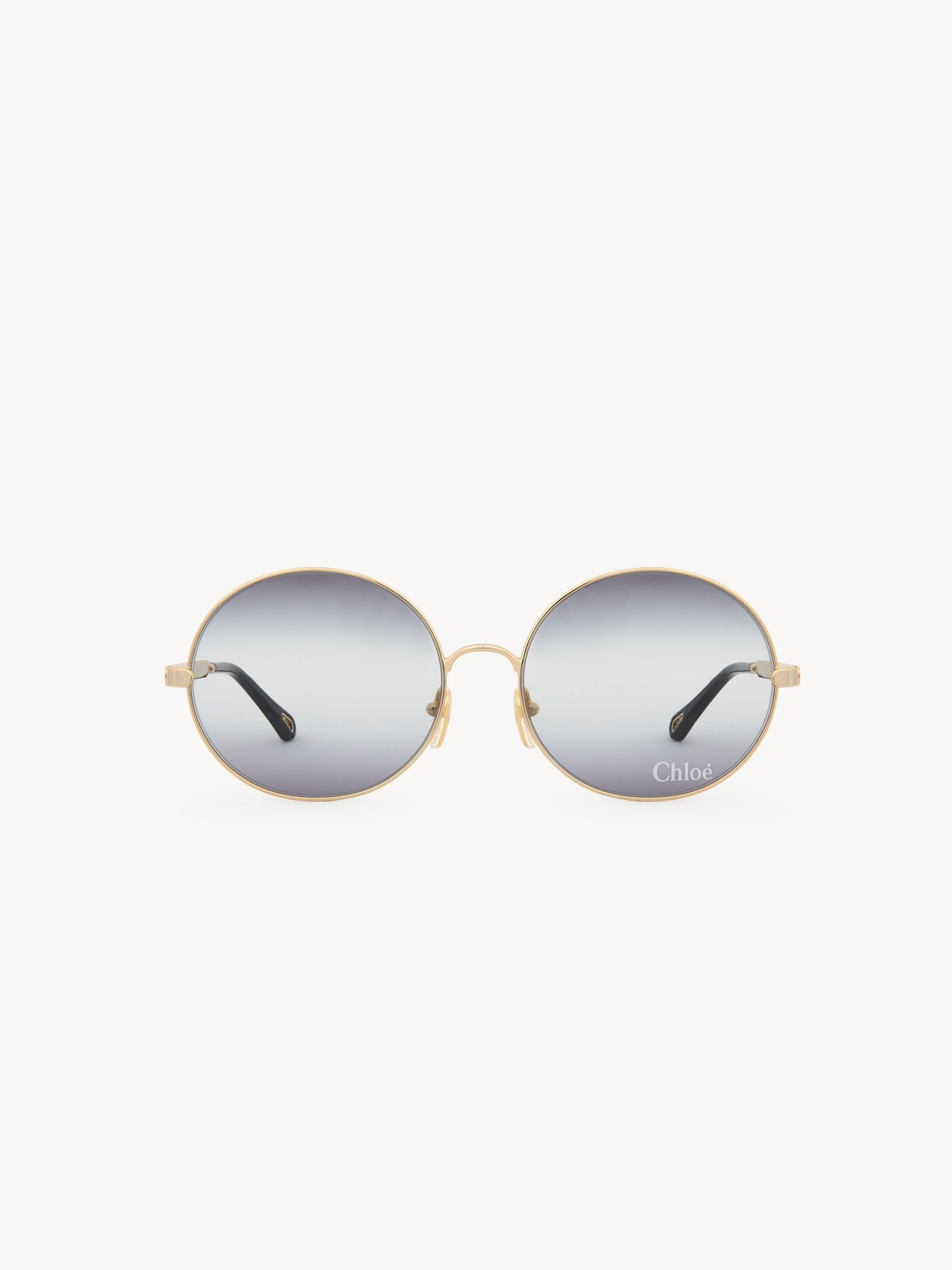 Aly sunglasses Gold metal & bio-based nylon
Gradient black, light grey & grey lenses Back view of the product