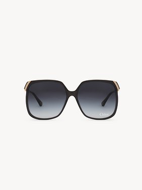 Aly sunglasses Dark grey lower-impact acetate, gold metal & bio-based nylon
Gradient blue lenses Back view of the product