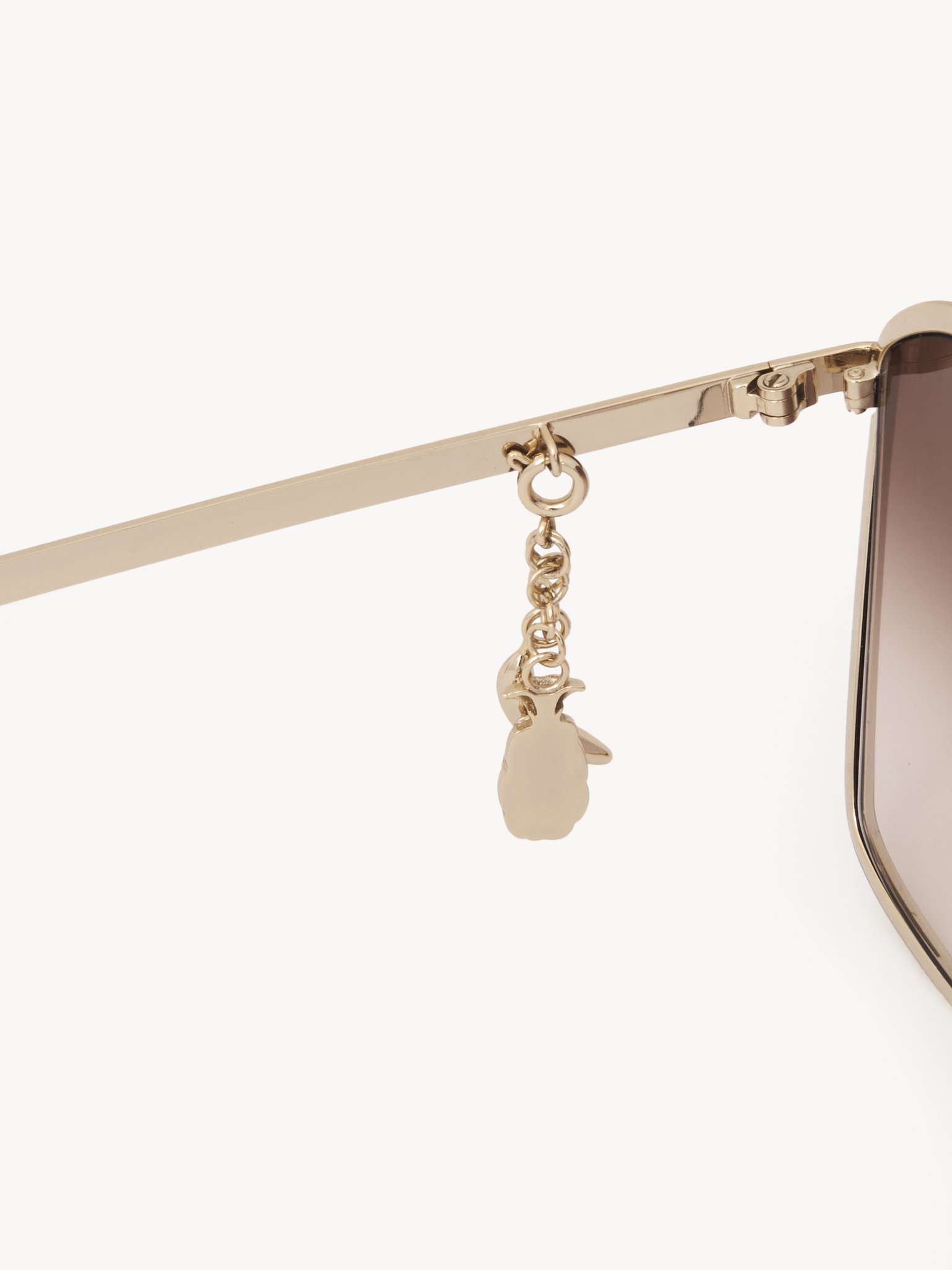 Chloé Charms sunglasses Gold metal, black enamel & bio-based nylon
Gradient brown lenses [*** acc_altImage_shotG ***]