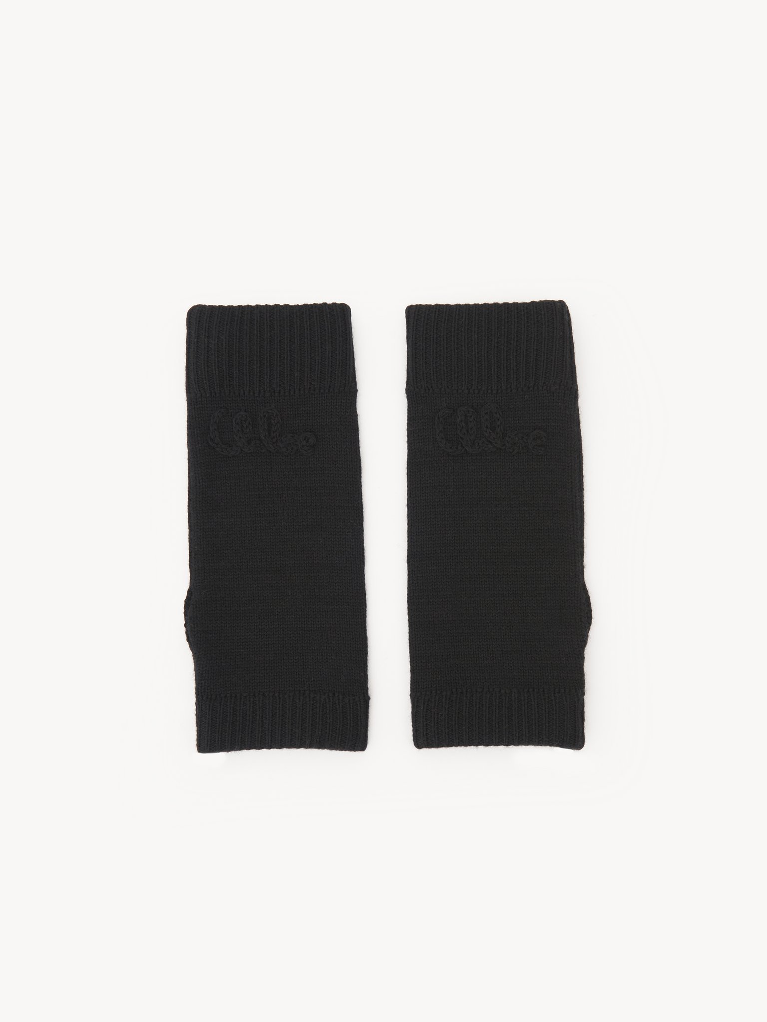 The Chloé Lace Knit fingerless gloves in wool & lace jacquard Merino wool & lace jacquard
Black